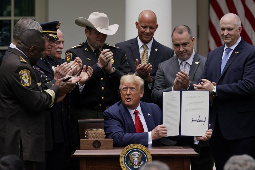 Trump signs order on police reform, but doesn’t mention racism